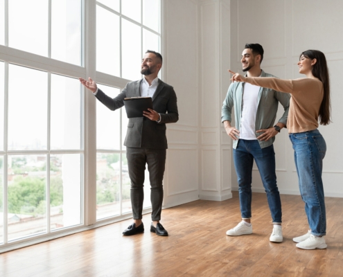 Estate Agent Showing Prospective Buyers Around Property